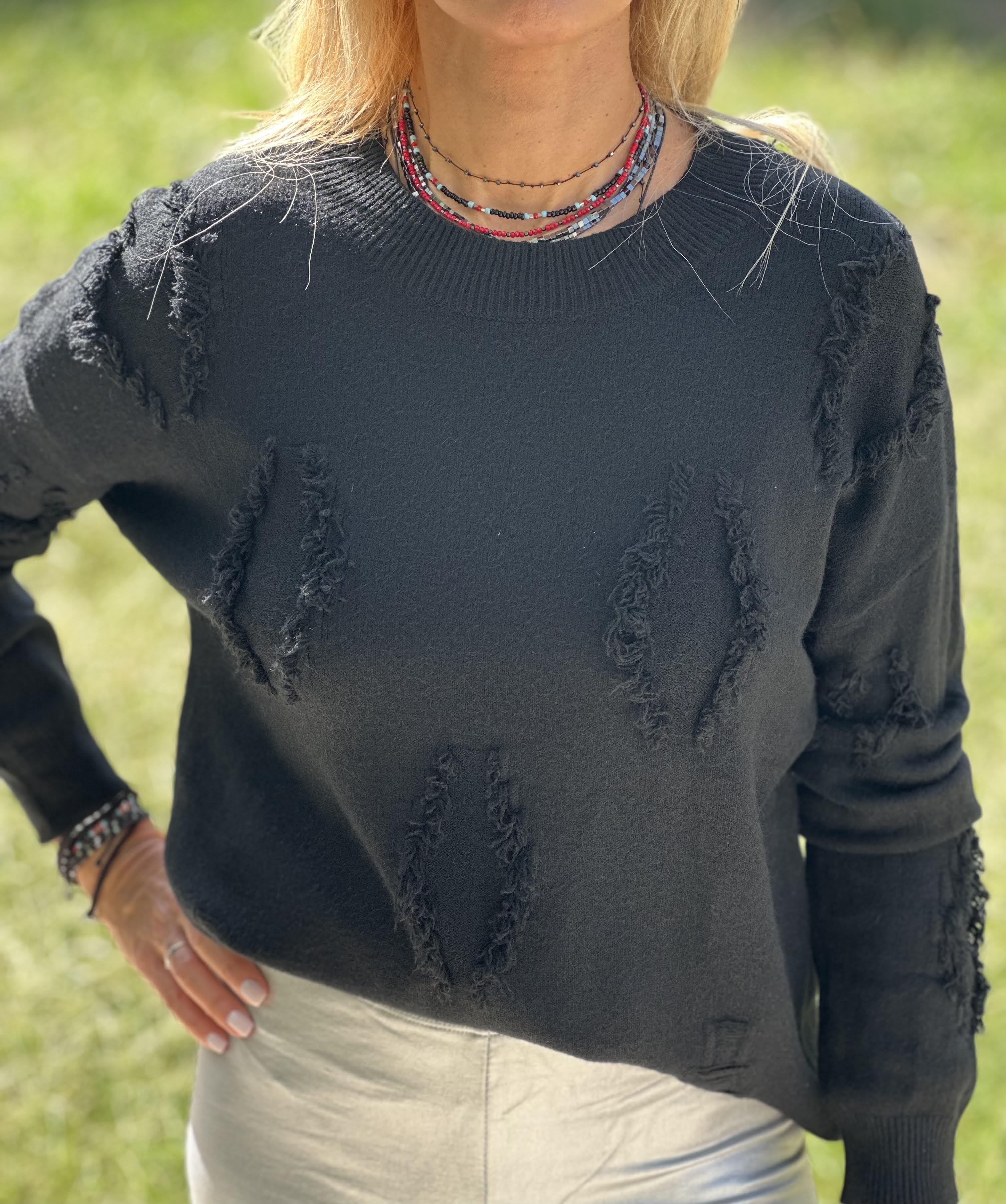 Knitted blouse with seams